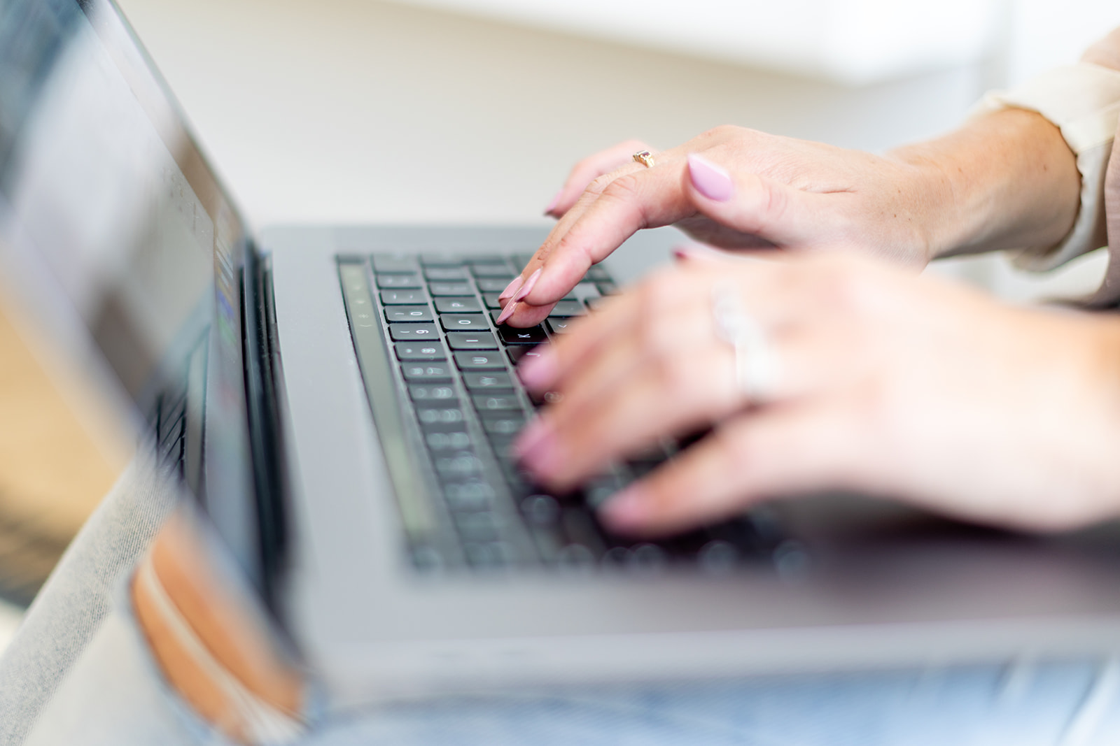 Web designer typing on a keyboard