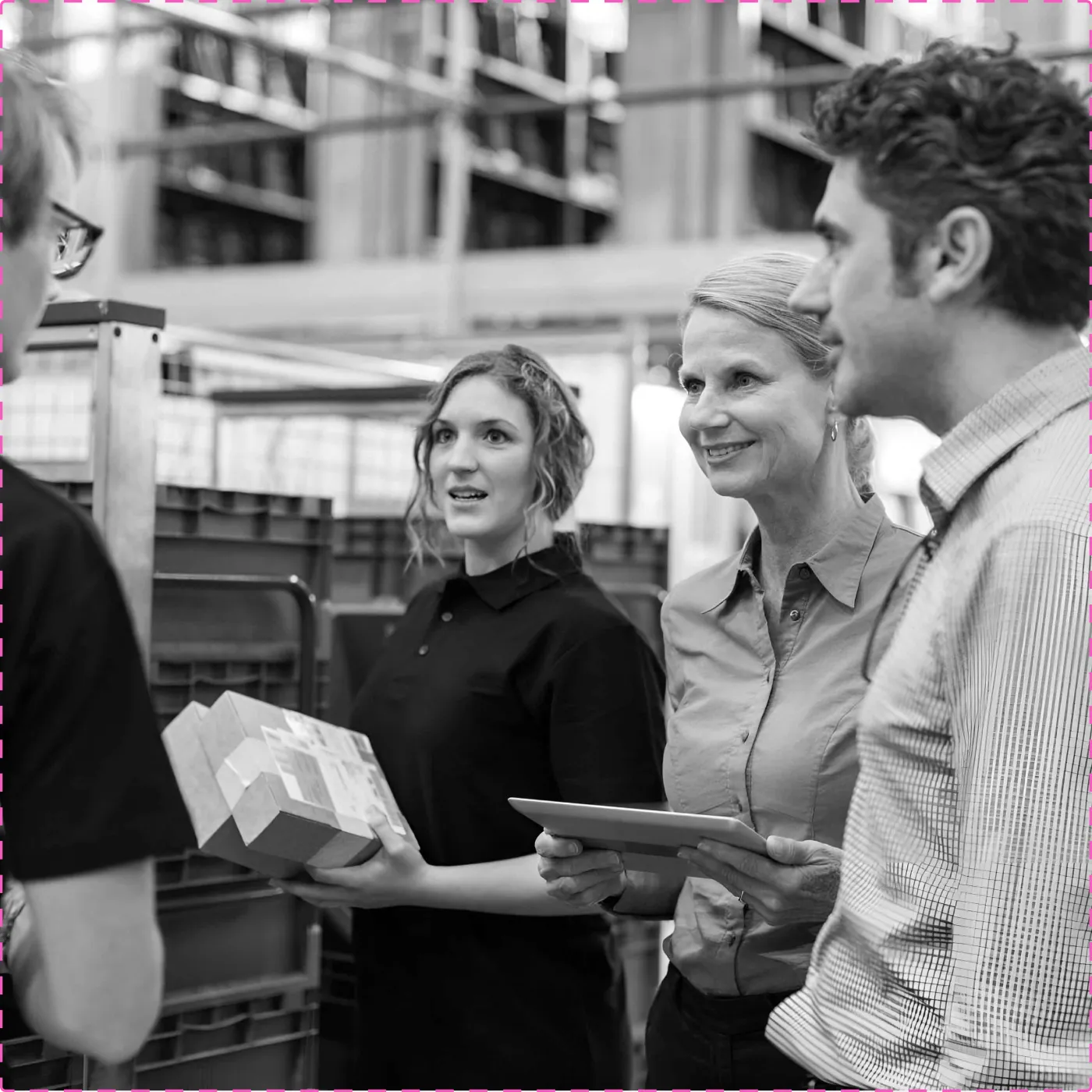 Bis Henderson people talking on a warehouse floor