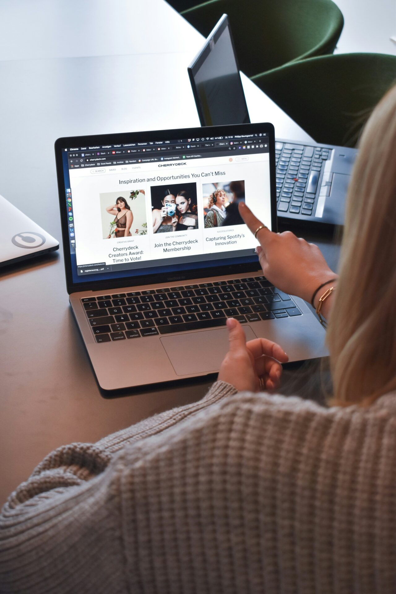 Marketing manager reviewing website content on laptop