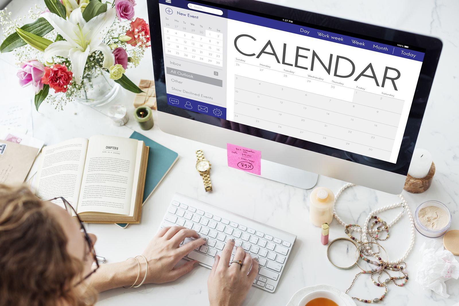 Content calendar open on a screen beside a planner
