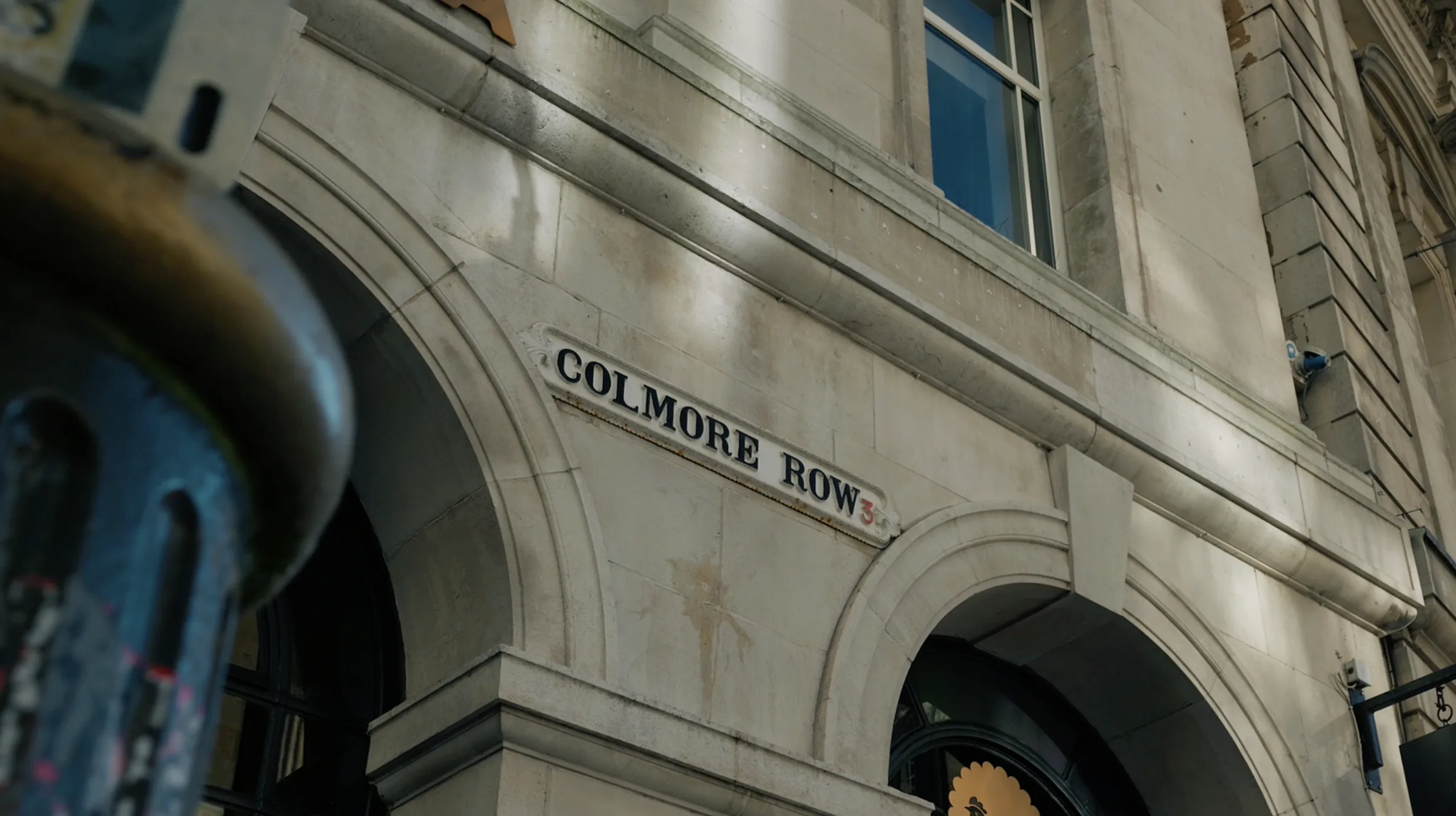The Colmore Row street sign on a Georgian stone facade