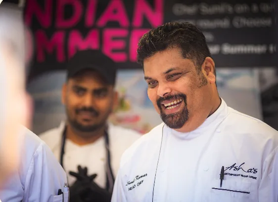A chef smiling at a Colmore food event
